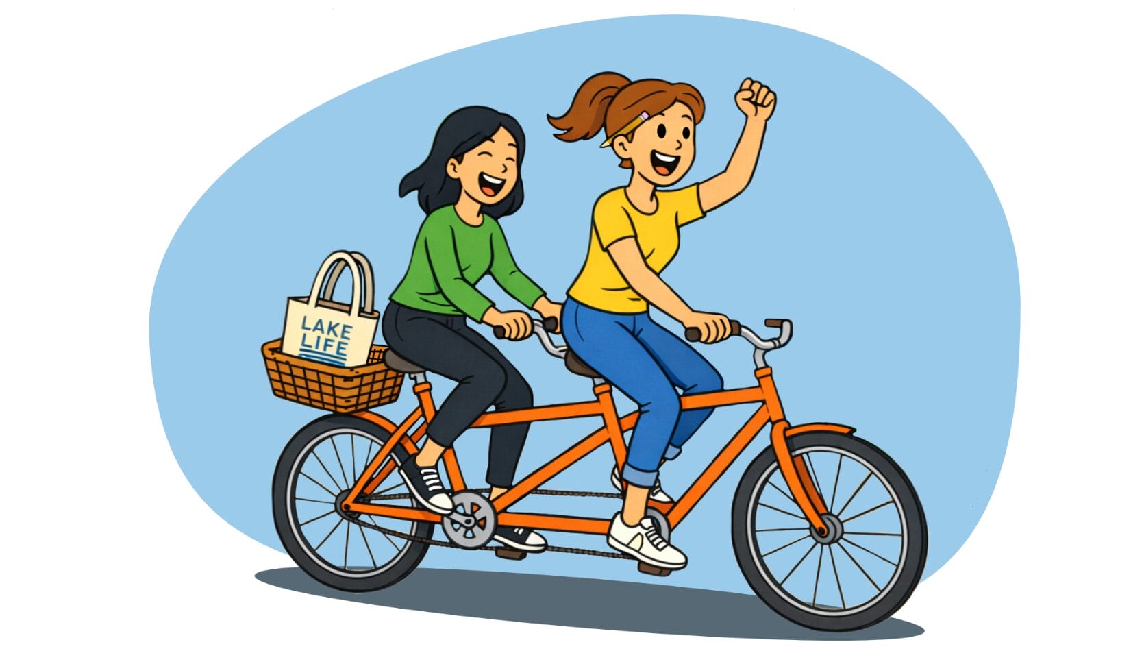Two women ride a tandem bike through a lakeside town.